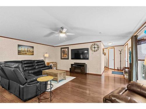 10 Downie Close, Carstairs, AB - Indoor Photo Showing Living Room With Fireplace