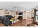 10 Downie Close, Carstairs, AB  - Indoor Photo Showing Living Room With Fireplace 