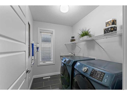 232 Sherwood Place Nw, Calgary, AB - Indoor Photo Showing Laundry Room