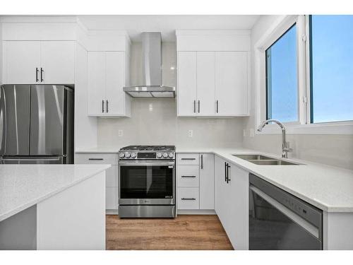 764 Creekside Boulevard Sw, Calgary, AB - Indoor Photo Showing Kitchen With Double Sink With Upgraded Kitchen