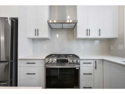 764 Creekside Boulevard Sw, Calgary, AB - Indoor Photo Showing Kitchen With Upgraded Kitchen