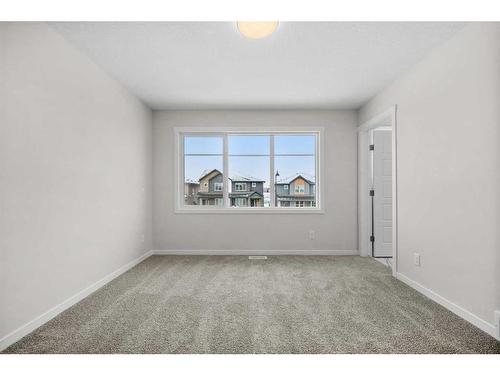 764 Creekside Boulevard Sw, Calgary, AB - Indoor Photo Showing Other Room