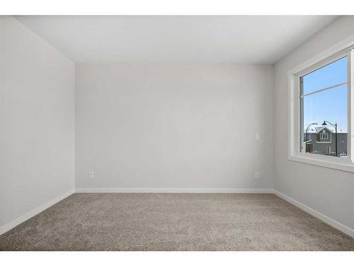 764 Creekside Boulevard Sw, Calgary, AB - Indoor Photo Showing Other Room