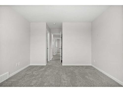 764 Creekside Boulevard Sw, Calgary, AB - Indoor Photo Showing Other Room