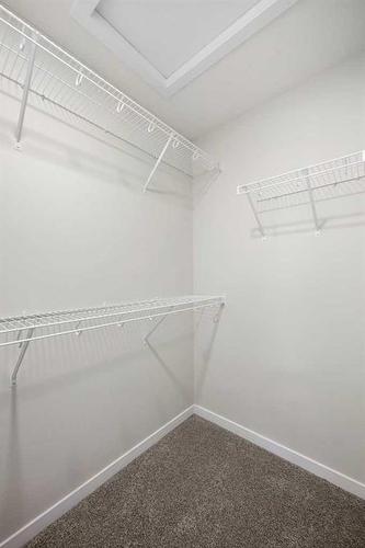 764 Creekside Boulevard Sw, Calgary, AB - Indoor With Storage