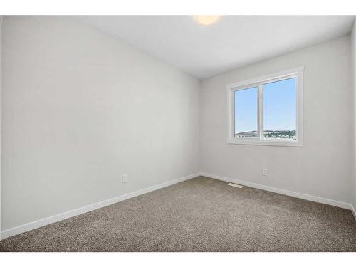 764 Creekside Boulevard Sw, Calgary, AB - Indoor Photo Showing Other Room