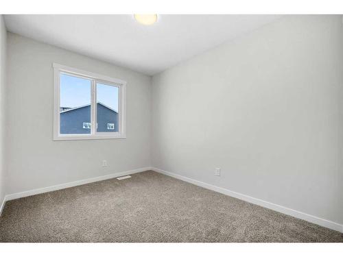 764 Creekside Boulevard Sw, Calgary, AB - Indoor Photo Showing Other Room