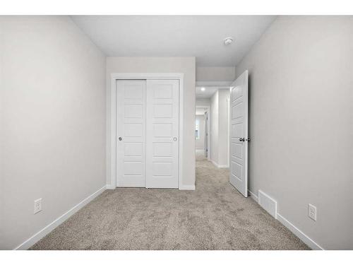 764 Creekside Boulevard Sw, Calgary, AB - Indoor Photo Showing Other Room