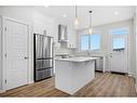 764 Creekside Boulevard Sw, Calgary, AB  - Indoor Photo Showing Kitchen With Upgraded Kitchen 