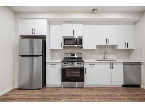 764 Creekside Boulevard Sw, Calgary, AB - Indoor Photo Showing Kitchen