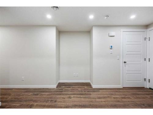 764 Creekside Boulevard Sw, Calgary, AB - Indoor Photo Showing Other Room