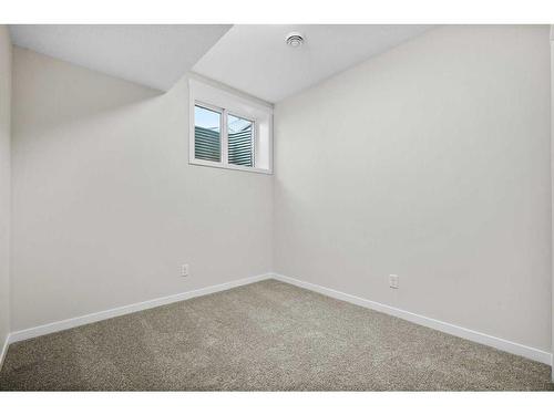 764 Creekside Boulevard Sw, Calgary, AB - Indoor Photo Showing Other Room