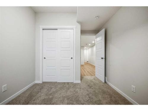 764 Creekside Boulevard Sw, Calgary, AB - Indoor Photo Showing Other Room