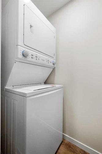 764 Creekside Boulevard Sw, Calgary, AB - Indoor Photo Showing Laundry Room