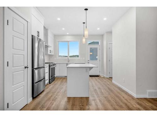 764 Creekside Boulevard Sw, Calgary, AB - Indoor Photo Showing Kitchen With Upgraded Kitchen