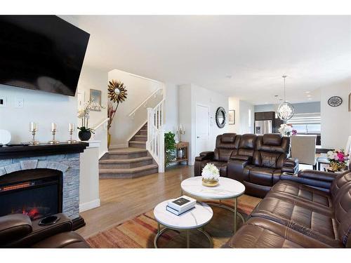 8 Corner Meadows Gate Ne, Calgary, AB - Indoor Photo Showing Living Room With Fireplace