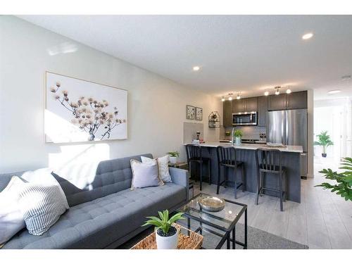 109-40 Livingston Parade Ne, Calgary, AB - Indoor Photo Showing Living Room