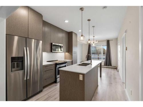 1123-76 Cornerstone Passage Ne, Calgary, AB - Indoor Photo Showing Kitchen With Stainless Steel Kitchen With Double Sink With Upgraded Kitchen