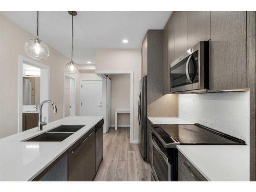 1123-76 Cornerstone Passage Ne, Calgary, AB - Indoor Photo Showing Kitchen With Double Sink With Upgraded Kitchen