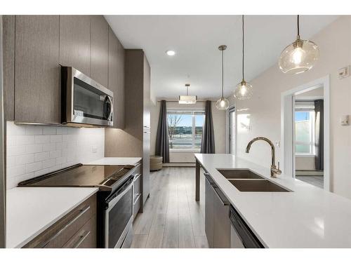 1123-76 Cornerstone Passage Ne, Calgary, AB - Indoor Photo Showing Kitchen With Double Sink With Upgraded Kitchen