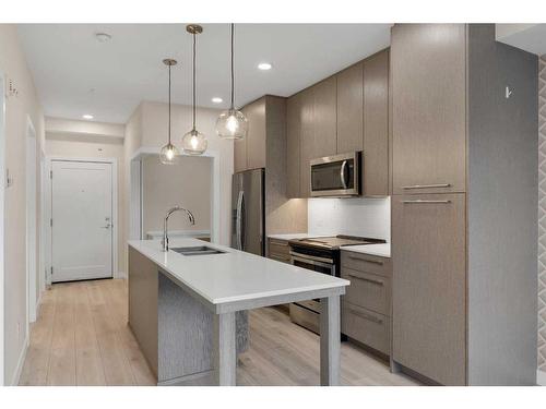 1123-76 Cornerstone Passage Ne, Calgary, AB - Indoor Photo Showing Kitchen With Double Sink With Upgraded Kitchen