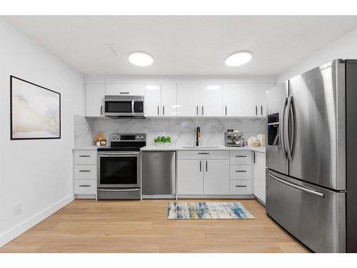 10816 Sacramento Drive Sw, Calgary, AB - Indoor Photo Showing Kitchen With Stainless Steel Kitchen With Upgraded Kitchen