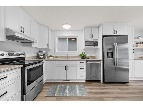 10816 Sacramento Drive Sw, Calgary, AB - Indoor Photo Showing Kitchen With Stainless Steel Kitchen With Upgraded Kitchen