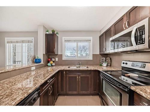 313-6315 Ranchview Drive Nw, Calgary, AB - Indoor Photo Showing Kitchen With Double Sink