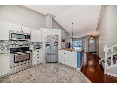 2435 Morris Crescent Se, Airdrie, AB - Indoor Photo Showing Kitchen With Upgraded Kitchen