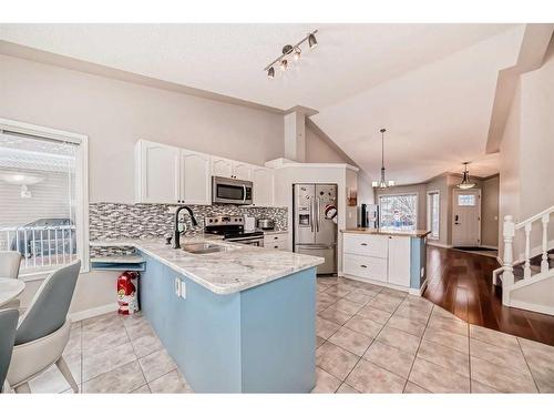 2435 Morris Crescent Se, Airdrie, AB - Indoor Photo Showing Kitchen With Upgraded Kitchen