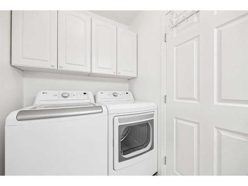 54 Rivercrest Villas Se, Calgary, AB - Indoor Photo Showing Laundry Room