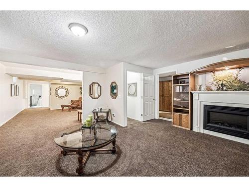 54 Rivercrest Villas Se, Calgary, AB - Indoor Photo Showing Living Room With Fireplace