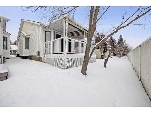 54 Rivercrest Villas Se, Calgary, AB - Outdoor With Deck Patio Veranda