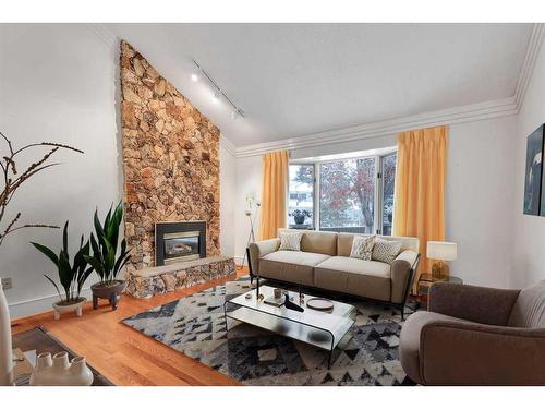 5-35 Oakmount Court Sw, Calgary, AB - Indoor Photo Showing Living Room With Fireplace