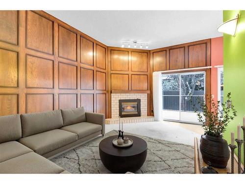 5-35 Oakmount Court Sw, Calgary, AB - Indoor Photo Showing Living Room With Fireplace