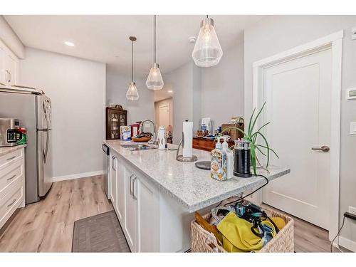 112-150 Shawnee Square Sw, Calgary, AB - Indoor Photo Showing Kitchen