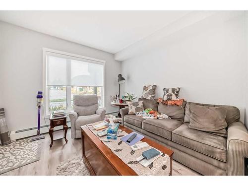 112-150 Shawnee Square Sw, Calgary, AB - Indoor Photo Showing Living Room