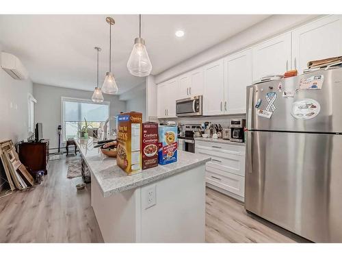 112-150 Shawnee Square Sw, Calgary, AB - Indoor Photo Showing Kitchen With Upgraded Kitchen