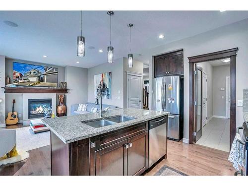 54 Redstone Mews Ne, Calgary, AB - Indoor Photo Showing Kitchen With Fireplace With Stainless Steel Kitchen With Double Sink With Upgraded Kitchen