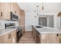 33 Cobbleridge Place, Airdrie, AB  - Indoor Photo Showing Kitchen With Upgraded Kitchen 