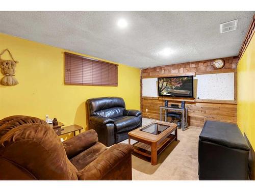 4431 21 Avenue Nw, Calgary, AB - Indoor Photo Showing Living Room With Fireplace