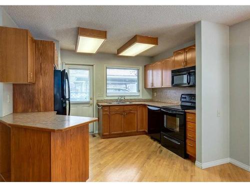 2828 Dovely Park Se, Calgary, AB - Indoor Photo Showing Kitchen With Double Sink