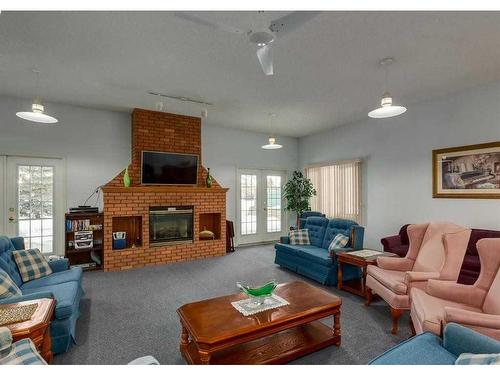 2828 Dovely Park Se, Calgary, AB - Indoor Photo Showing Living Room With Fireplace