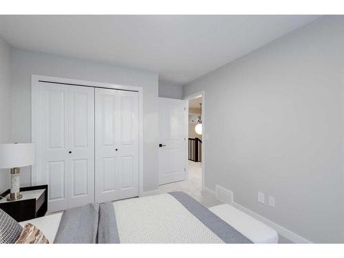 104 Sundown Crescent, Cochrane, AB - Indoor Photo Showing Bedroom