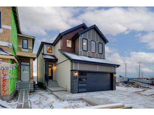 104 Sundown Crescent, Cochrane, AB - Outdoor With Facade