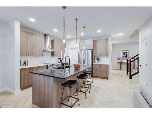 104 Sundown Crescent, Cochrane, AB - Indoor Photo Showing Kitchen With Double Sink With Upgraded Kitchen