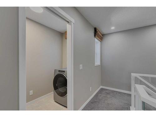 180 Magnolia Terrace Se, Calgary, AB - Indoor Photo Showing Laundry Room