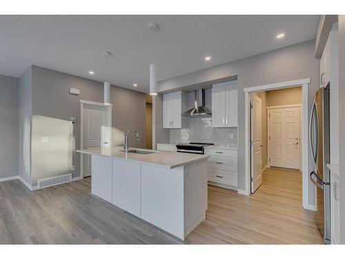 180 Magnolia Terrace Se, Calgary, AB - Indoor Photo Showing Kitchen With Upgraded Kitchen