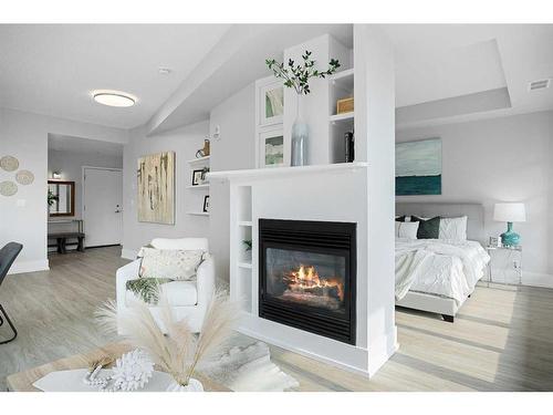 908-205 Riverfront Avenue Sw, Calgary, AB - Indoor With Fireplace