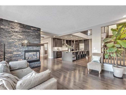 163 Cranarch Circle Se, Calgary, AB - Indoor Photo Showing Living Room With Fireplace